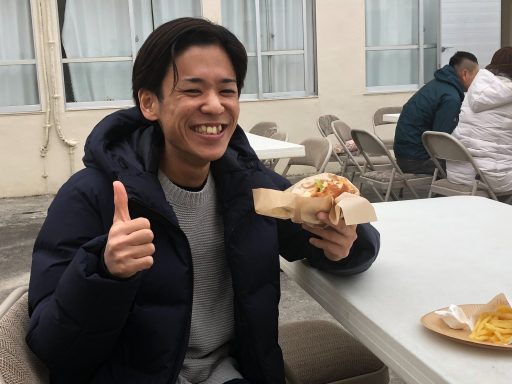 Photo of Japanese man enjoying Ha Heaven's Burger.